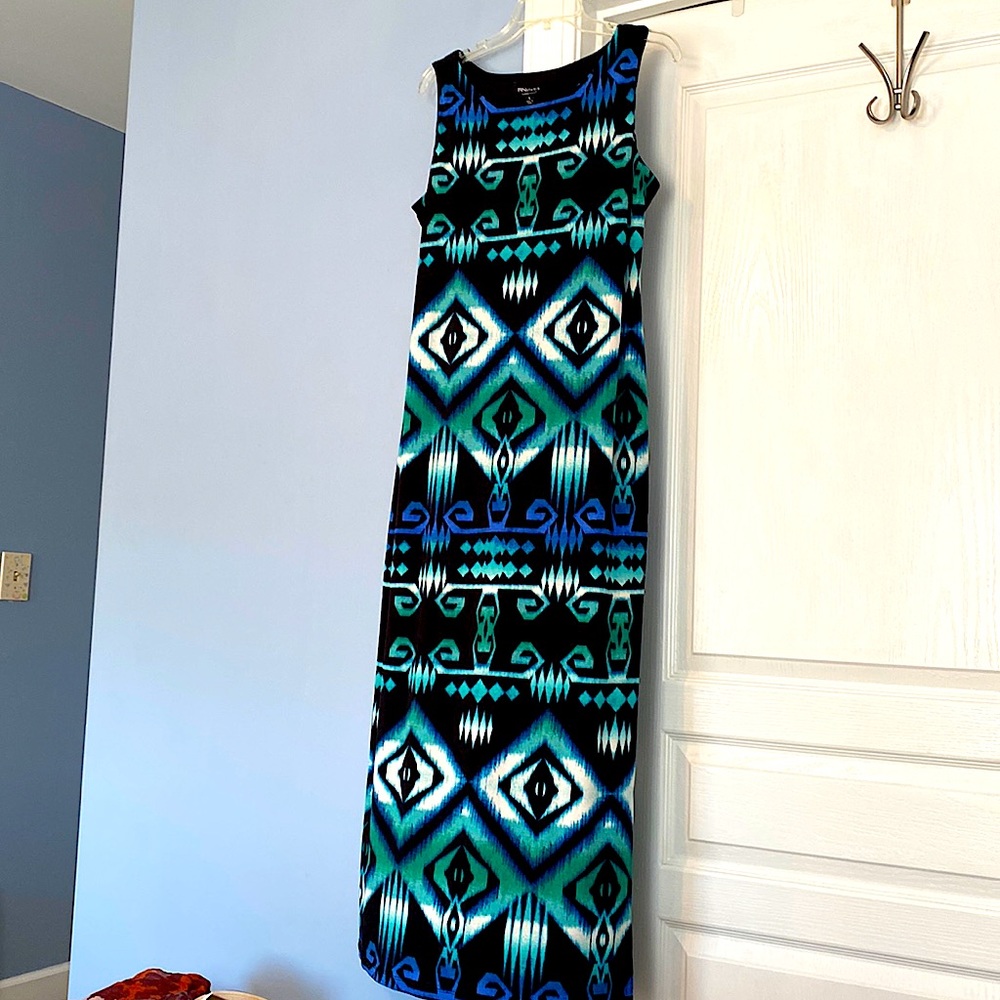 Sleeveless Dress - Flatters the figure with the long lines.